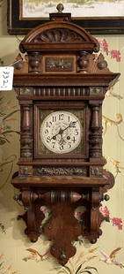Gustav Becker Highly Ornate Oak Wall Clock: 19th Century GB time and strike Oak wall clock with fancy pendulum adorned with Angels. Running measures 37" high x 15" wide x 8 " deep.