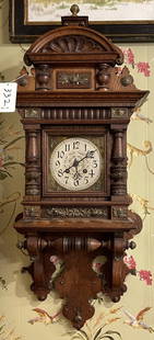 Lenzkirch Highly Ornate Oak Wall Clock: 19th Century GB time and strike Oak wall clock with fancy pendulum adorned with Angels. Running measures 37" high x 15" wide x 8 " deep.