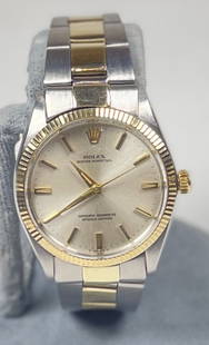 Vintage Rolex Oyster Perpetual Gold & Steel Mens Wristwatch: Rolex reference no. 1005. From 1965, original stainless steel & solid 14k gold case. Running strong and keeping time. Excellent unpolished condition.