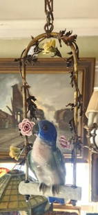 German Porcelain Parrot Form Chandelier: Brass frame with porcelain parrot and flowers, missing one glass eye.