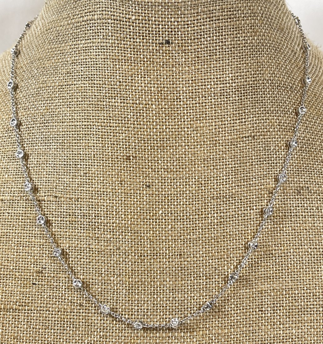 14k White Gold Diamonds by the Yard Necklace: White gold and diamond necklace, measures 20" long with 58 double sided diamonds. Total weight 8.8 grams.