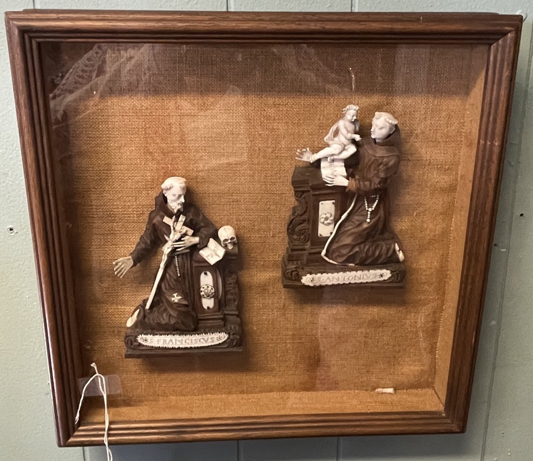 18/19th Century Carved Religious Icons in Shadowbox Frame: Carved walnut and bone icons depicting monks. Overall good condition, detached arm but present and hand appears to be replaced to the left icon.