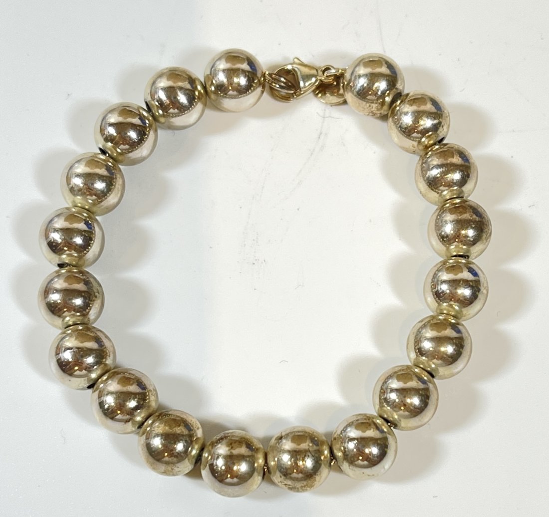 Tiffany & Company Sterling Silver Ball Bracelet: Comes with a box and pouch. Measures 7.5" long. Total weight 15 grams.