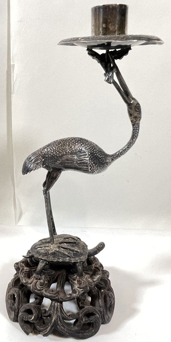Asian Silver Crane Form Candlestick: Crans standing on top of a turtle, rosewood base. No mark to be found. Overall very good condition, tiny break to the rosewook base.