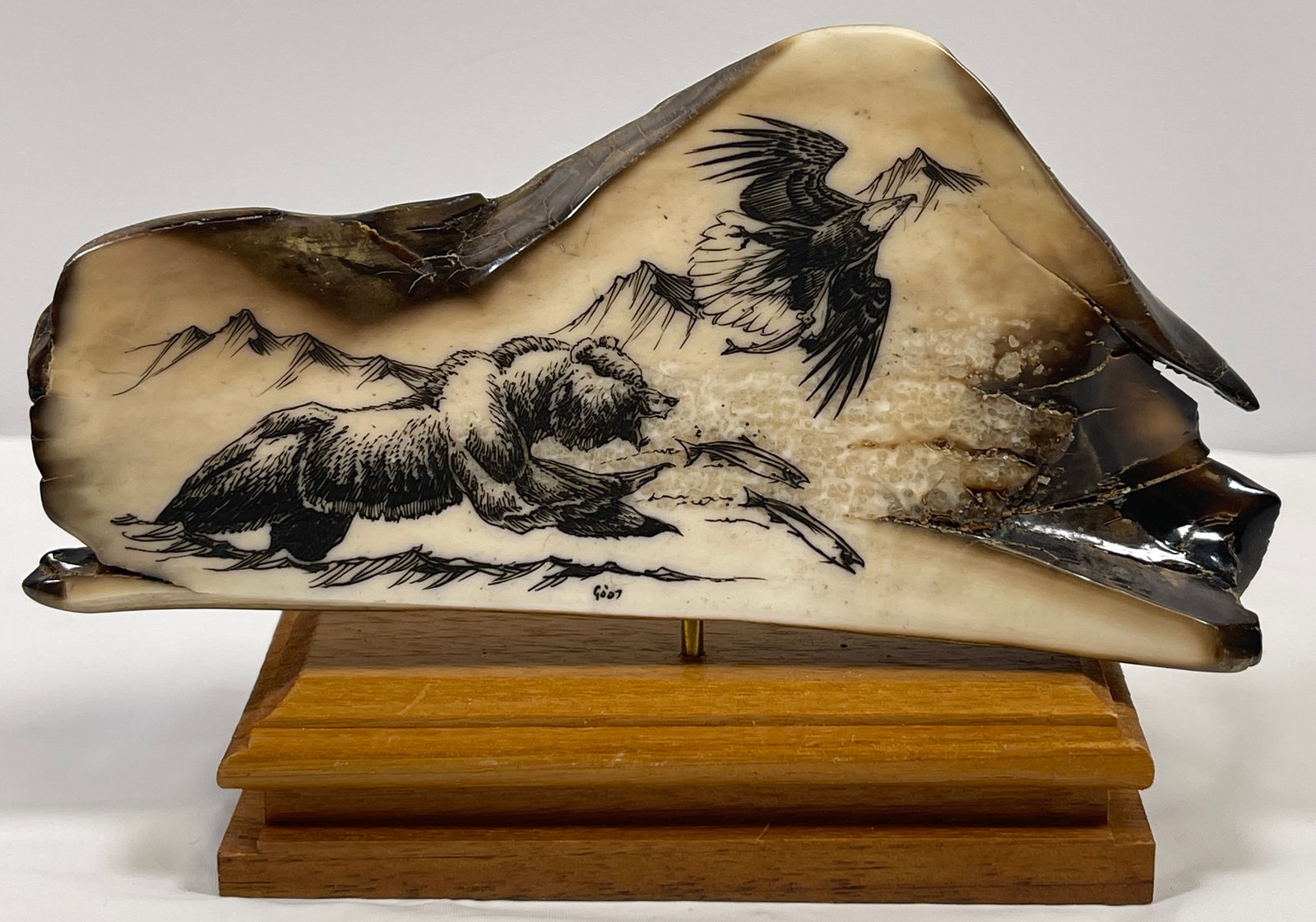 Antique Alaska Scrimshaw Bear & Eagle: Mounted on wood, actual scrimshaw measures 5 in long x 2.5 in high.