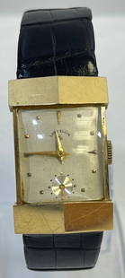 14k Yellow Gold Lord Elgin Tank Watch: Gubelin swiss leather band in as found condition. Marked on back Apex 14k gold, 51129768. Keeping time. 44mm long x 19mm wide.