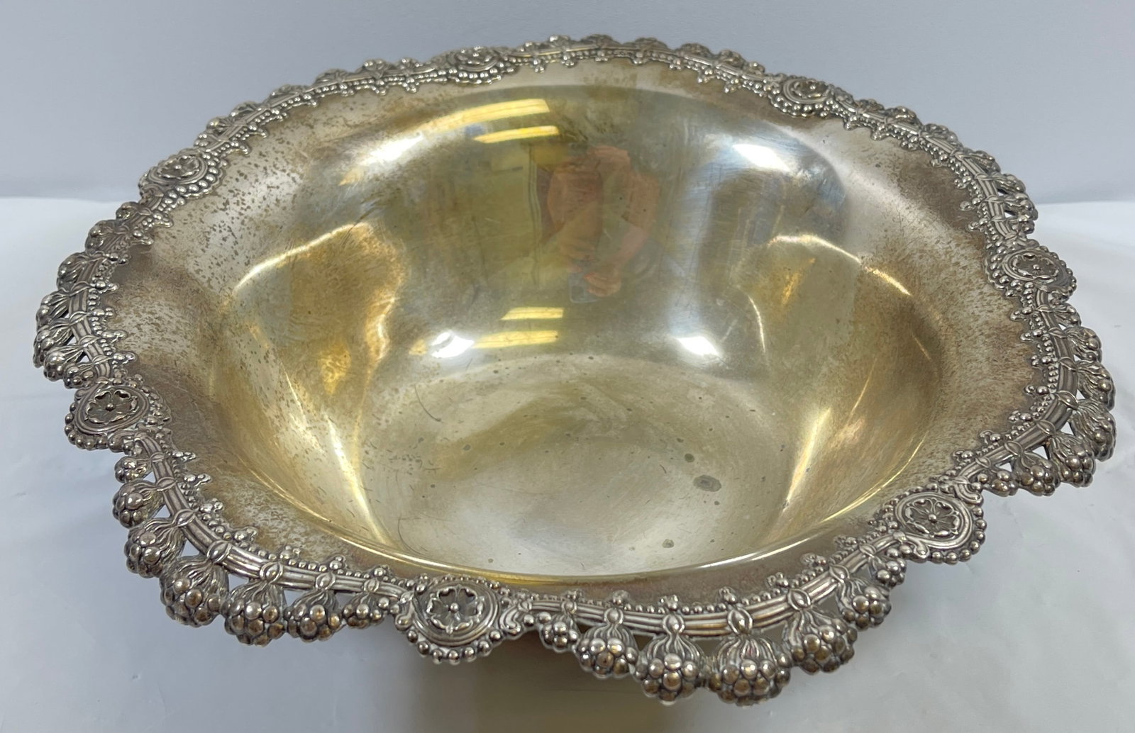 Tiffany & Co. Makers Sterling Silver Bowl (1907-1947): Marked to reverse 'Tiffany & Co./ 13870E Makers 135/ Sterling Silver/ 925-1000/', italic mark 'm' for John C. Moore II (1907-1947) and '10 in.', the low bowl with everted rims cast and pierced with gr
