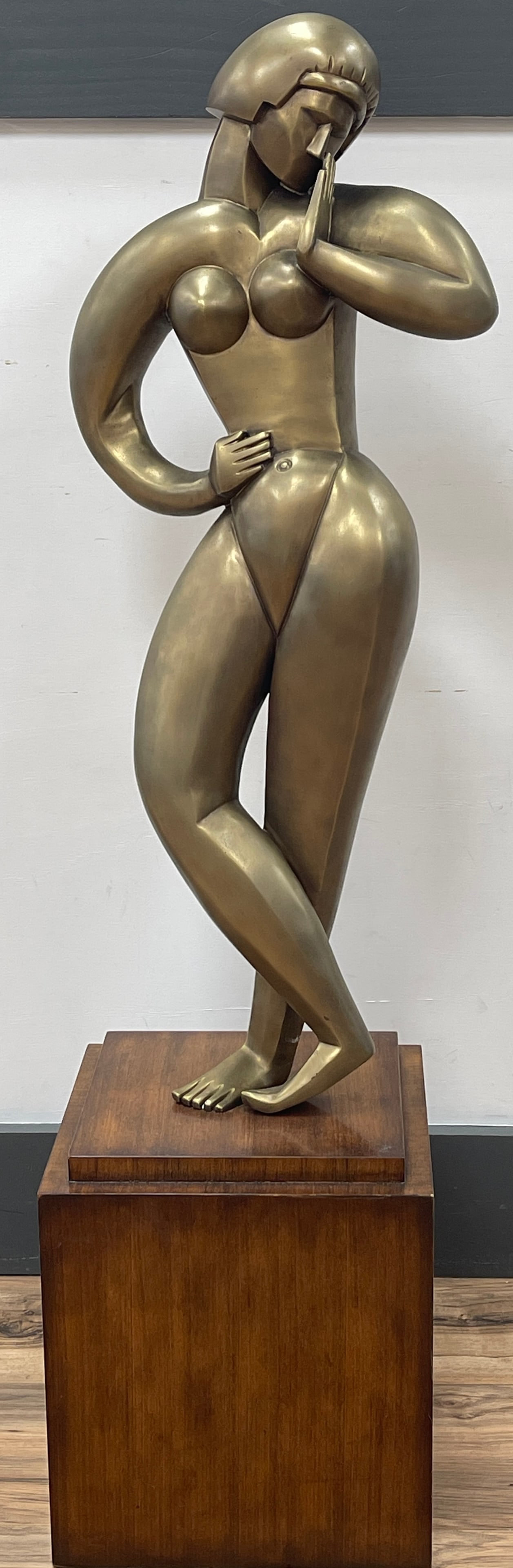 Art Deco Style Theodore Alexander Contrapposto Brass Statue Female Nude: A Brass statue of a female nude after Constantin Brancusi, standindg contraposto, mounted on a stepped morado plinth. 13 inches wide × 11 inches deep × 42 inches high.