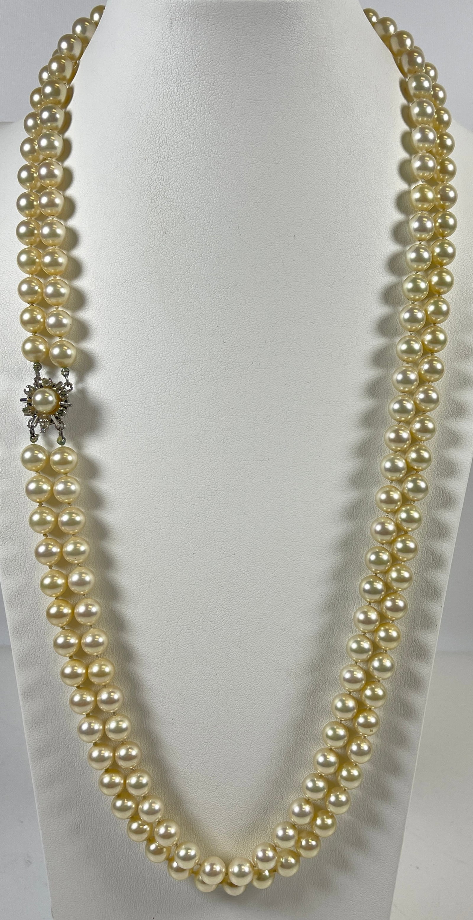 Vintage 14k White Gold Diamond & Double Strand Knotted Pearl Necklace: Marked 835. 6 diamond surround a 6mm pearl on clasp. Pearls approx 6mm. Measures approx 29 inches long. Overall good condition.