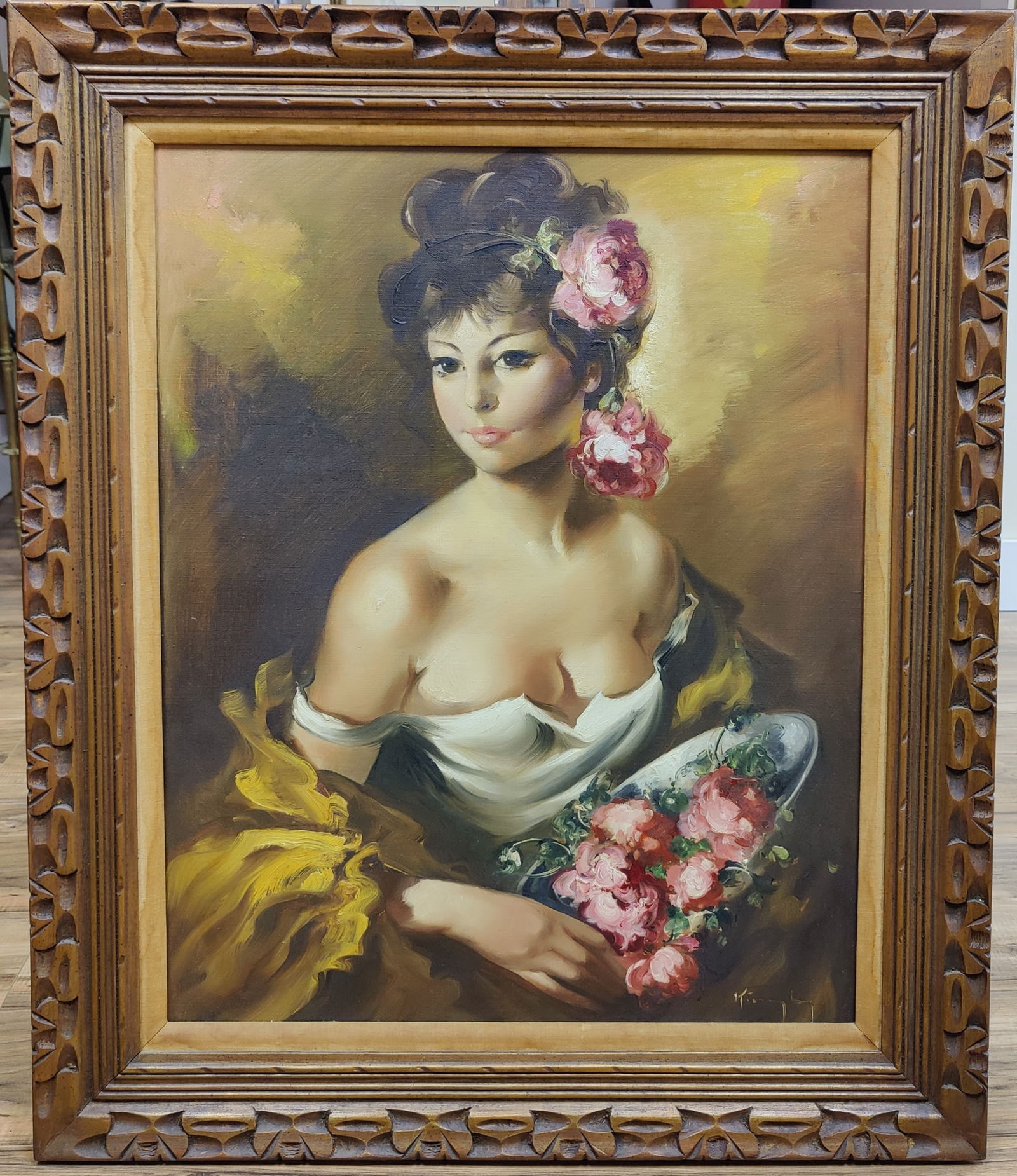 Illegibly Signed Beautiful Woman and Roses Style of Pal Fried: An illegibly signed O/C painting of a beautiful Woman holding and wearing roses in the style of Pal Fried c. 1970s. Painting is signed lower right. Very good condition and in an ornately decorated car