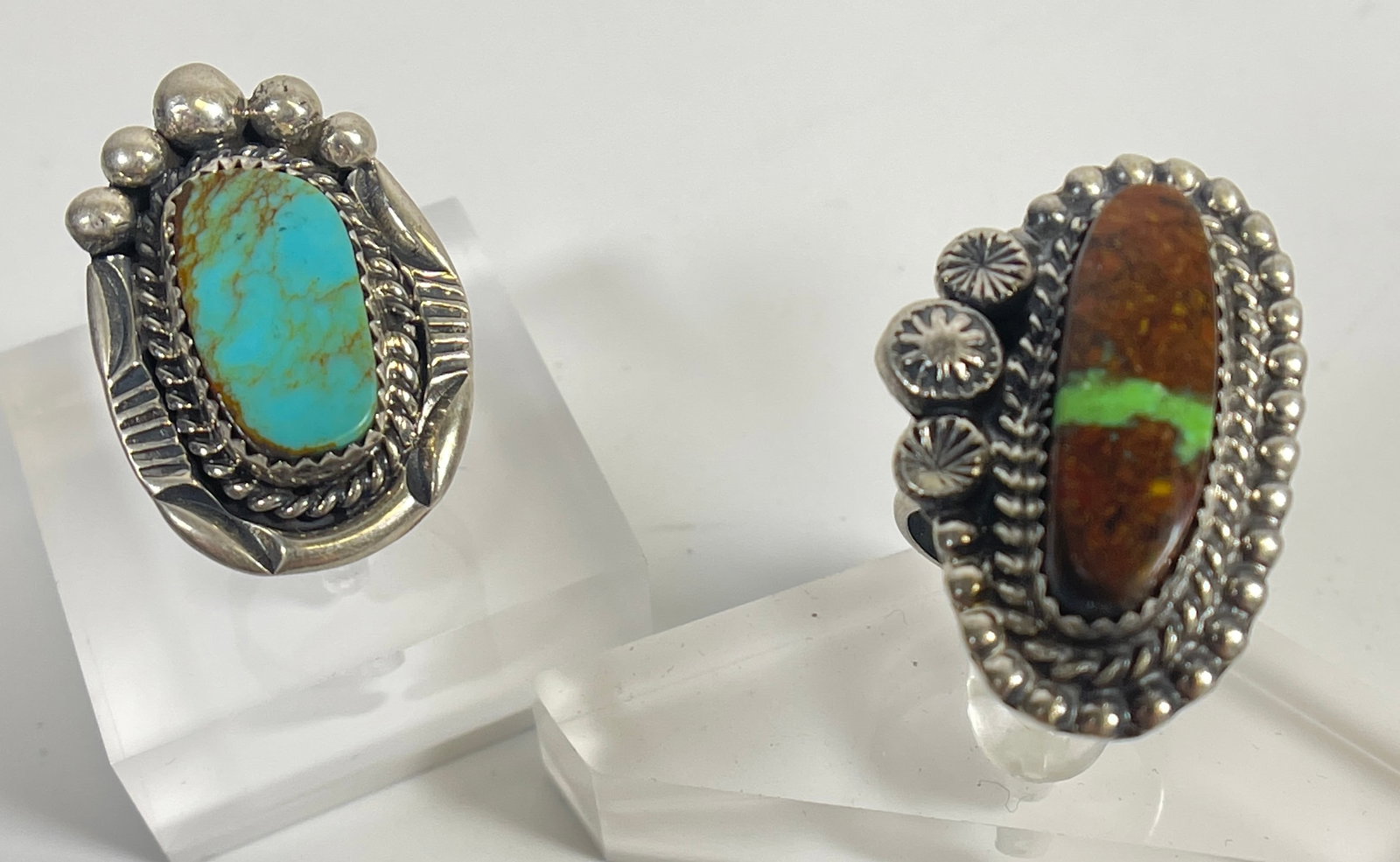 Lot of 2 Native American Inspired Kay Johnson Sterling Silver & Turquoise Rings: Blue turquoise ring size 6, green and brown turquoise ring size 8.5. 19.4 grams total weight.