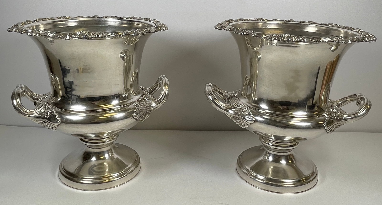 c1900 Pair of Silver Plate Two Handle Champagne / Wine Buckets: Overall very good condition. No marks other than etched words into one on the bottom. Measures 9.5 inches high, 9.5 handle to handle, 9 inch diameter across the top.