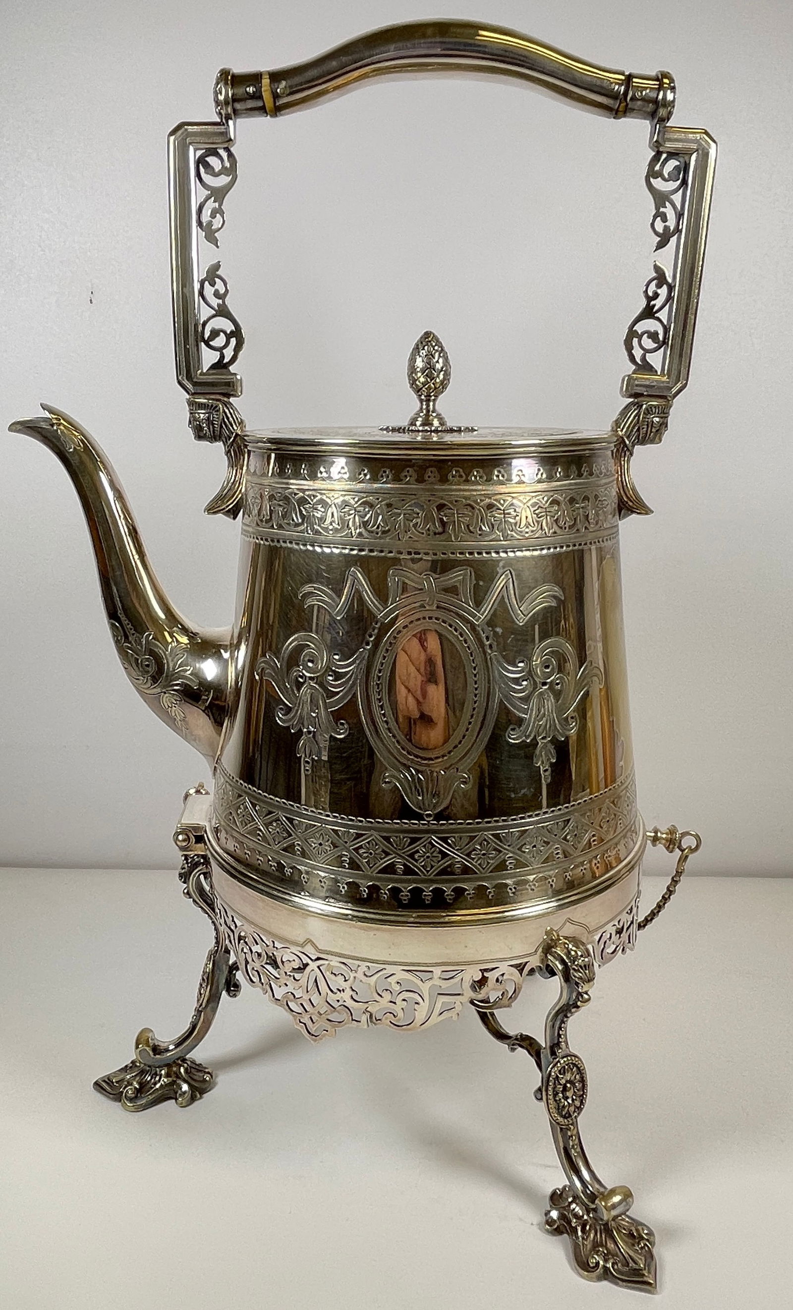 Egyptian Revival Chased Silver Plate Tippler Water Kettle: Hallmarks on bottom. Overall good condition, some worn through areas, please see photos. Measures 17 inches high, 10 inches wide.
