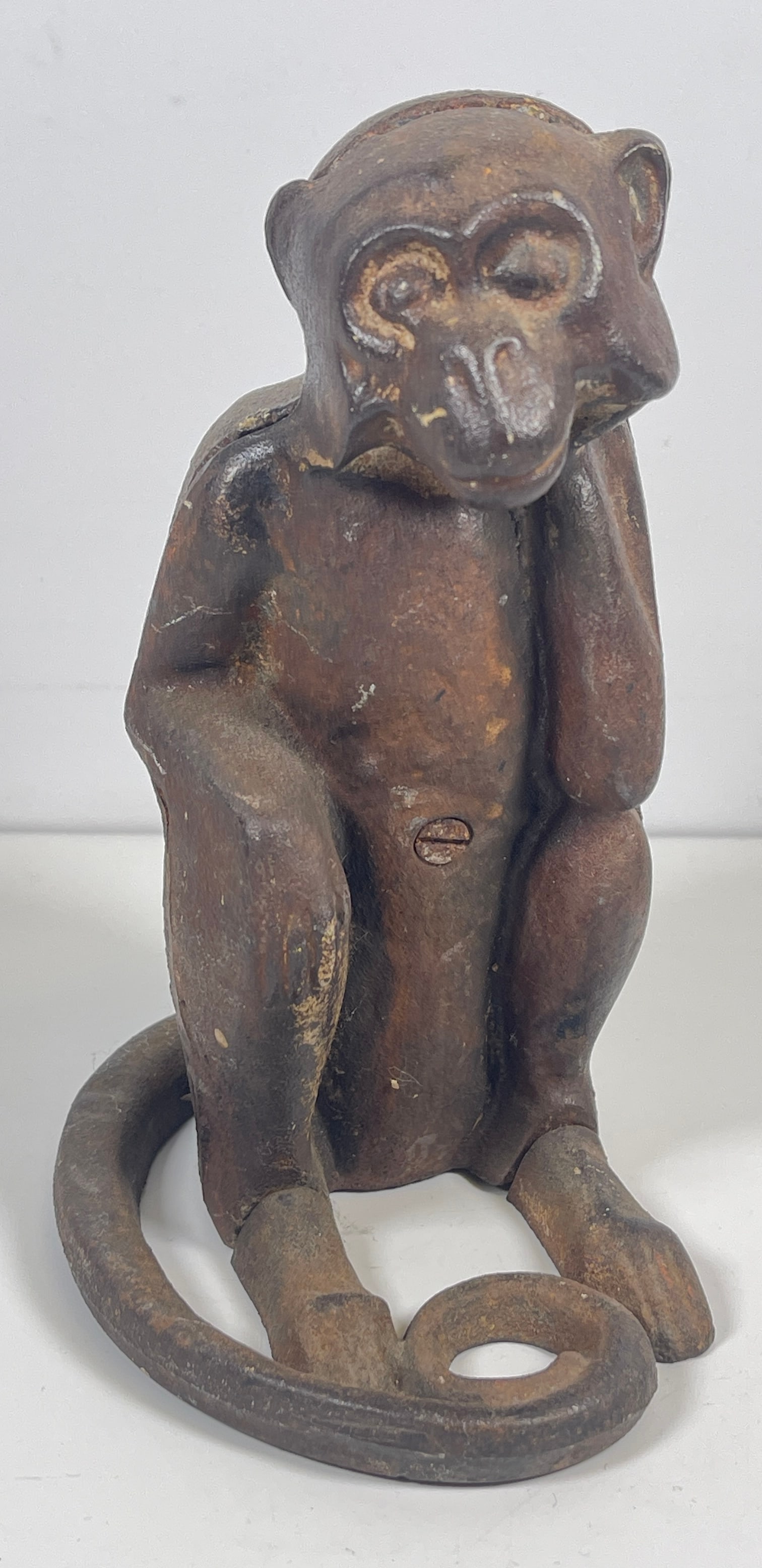 c1920 Hubley Cast Iron Monkey Bank / Door Stop: Hubley cast iron figural coin bank or door stop. The ware represents a sitting monkey with a long swirl tail. Circa: 1920s. Unmarked. Measures 8 inches high. Overall good vintage condition. Signs of a