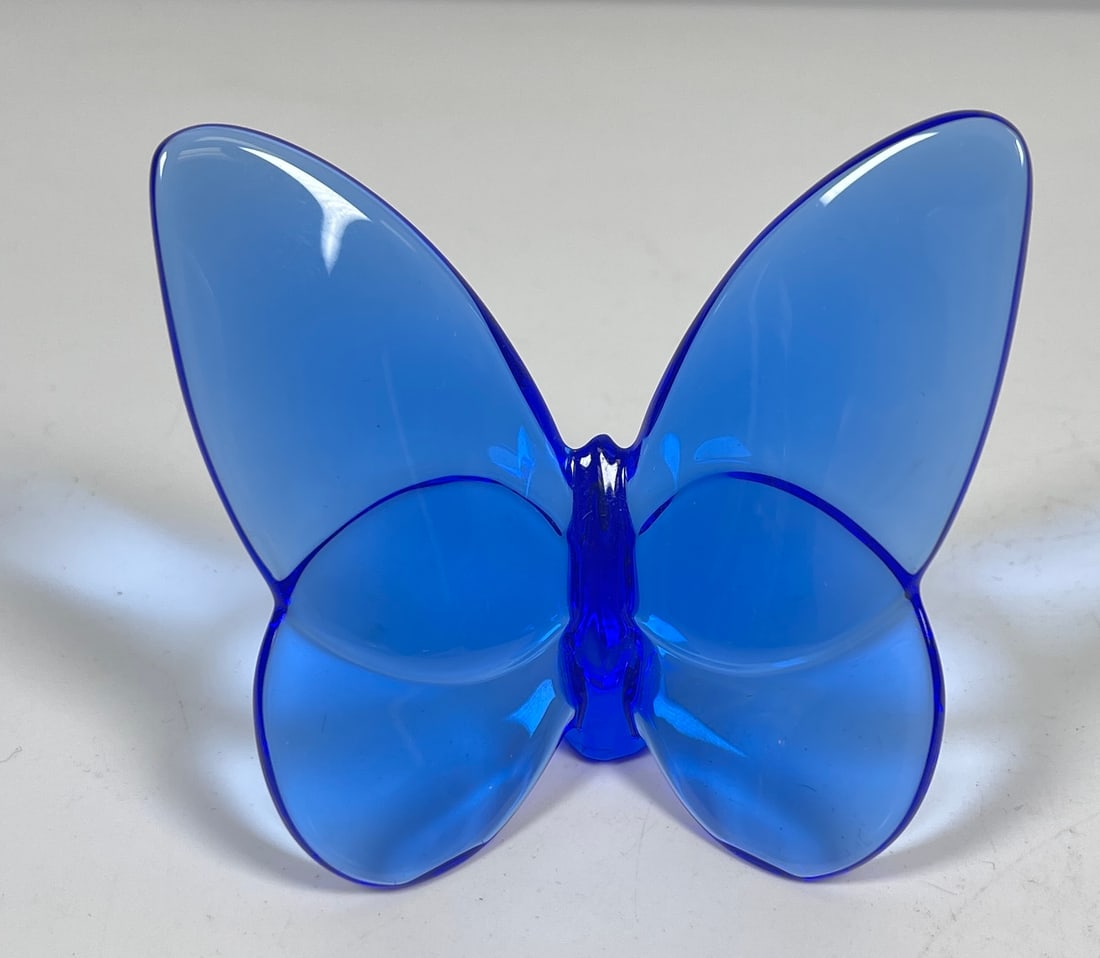 Baccarat Crystal Dark Blue Butterfly Figurine: A Baccarat crystal butterfly figurine crafted with a deep blue crystal foundation, acid etched with baccarat seal. H: 2.75 inches x W: 3.25 inches. Overall excellent condition, no chips or cracks.