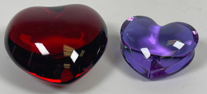Lot of 2 Baccarat Crystal Heart Paperweights: To include red heart (3 inches long) and pink heart (1.75 inches long). Overall excellent condition, no chips or cracks.