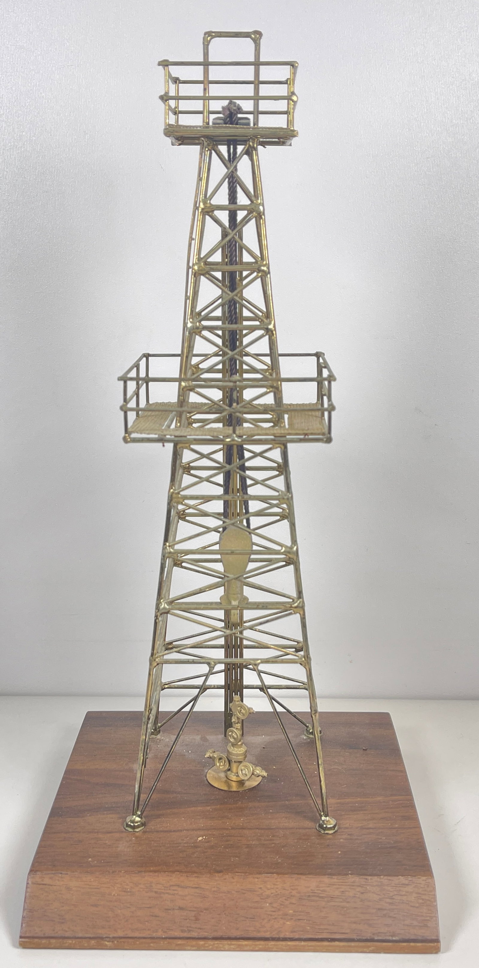 Folk Art Metal Replica of Oil Rig Walnut Base: Overall good condition. Measures 15.5 inches high, 7 inch square base.