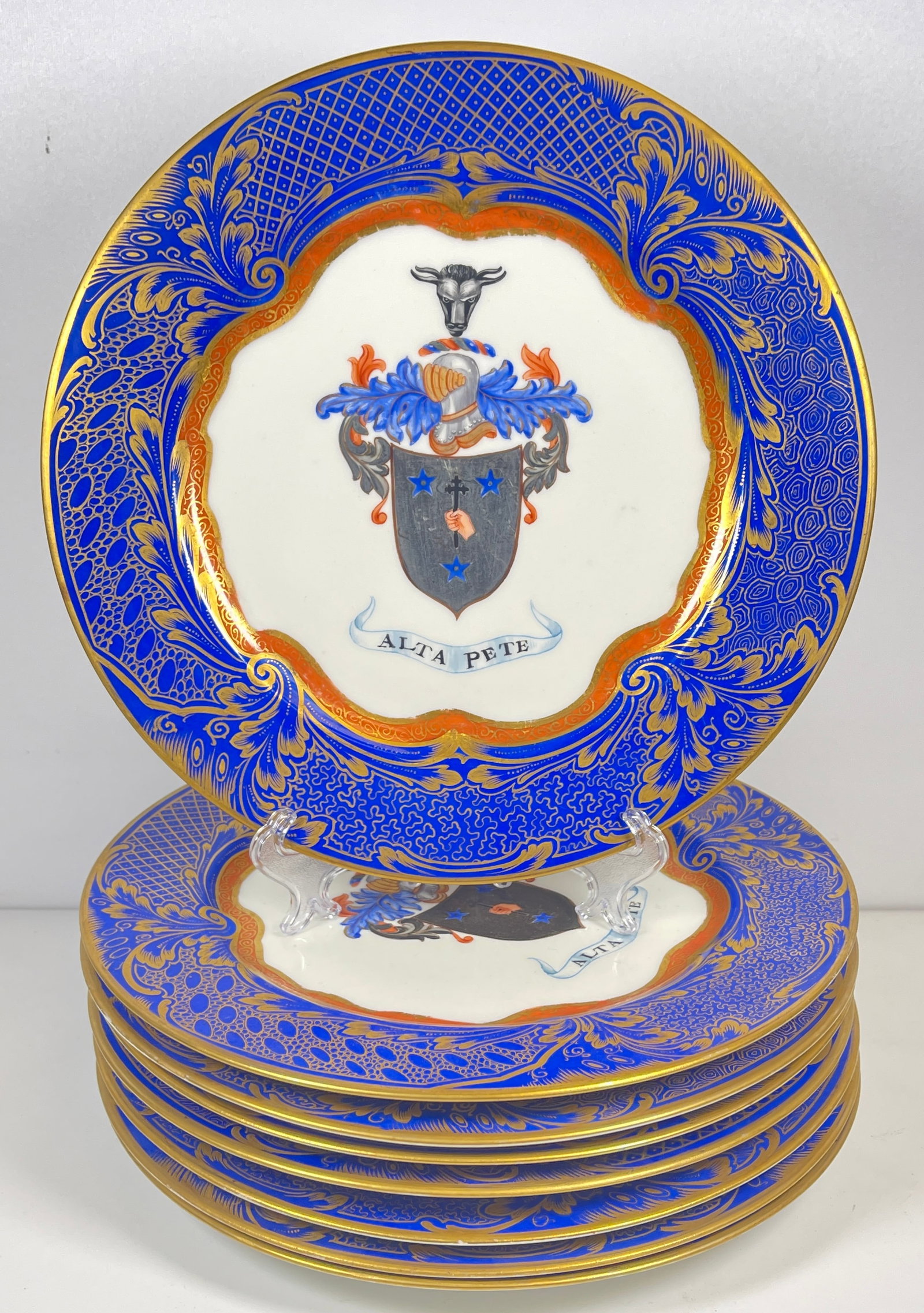 19th Century Lot of 8 Porcelain Hand Painted Chargers: "Alta pete" with a coat or arms hand painted on the cobalt and gilt trimmed plates. Unknown makers mark verso. Charger measures 11 inches in diameter. Overall good condition, no chips or cracks.