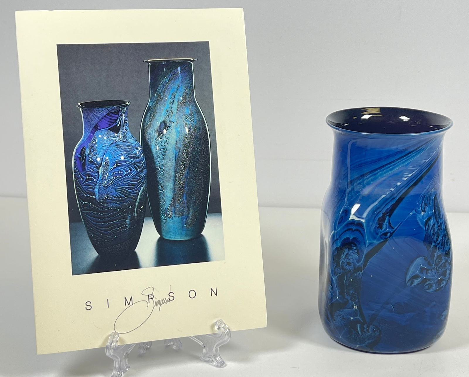 Contemporary Josh Simpson Blue New Mexico Galaxy Vase: Measures 4.75 inches high, approx 2.5 inches square across the bottom. Comes with pamphlet from Josh Simpson. Overall very good condition.