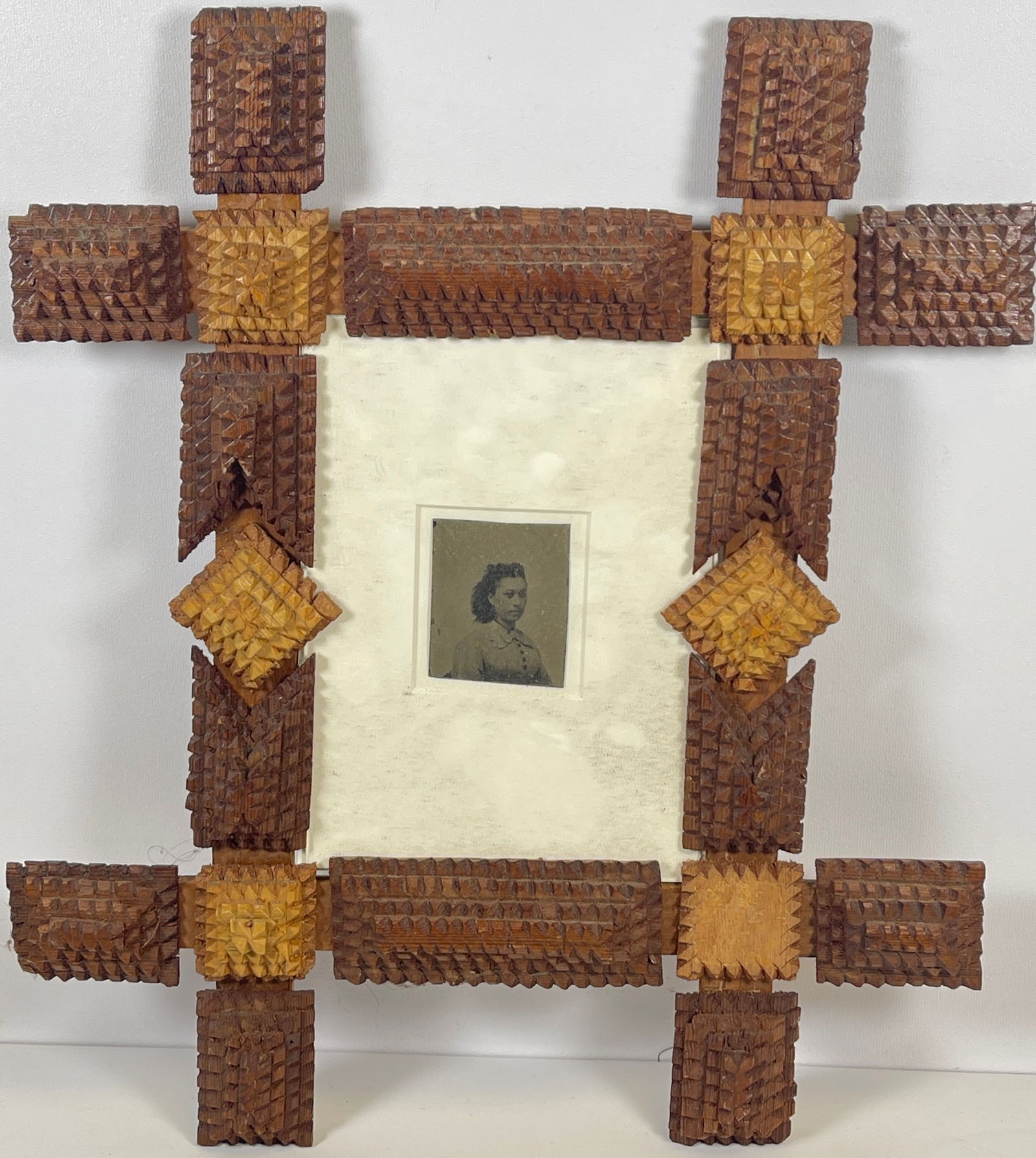 19th Century Tramp Art Frame: Antique tramp art frame, overall good condition. Matte under glass included. Slight areas of chipping, issing a corner, please see photos. Holds a 5 x 7 inch picture. Total meaurement 12 x 14 inches.