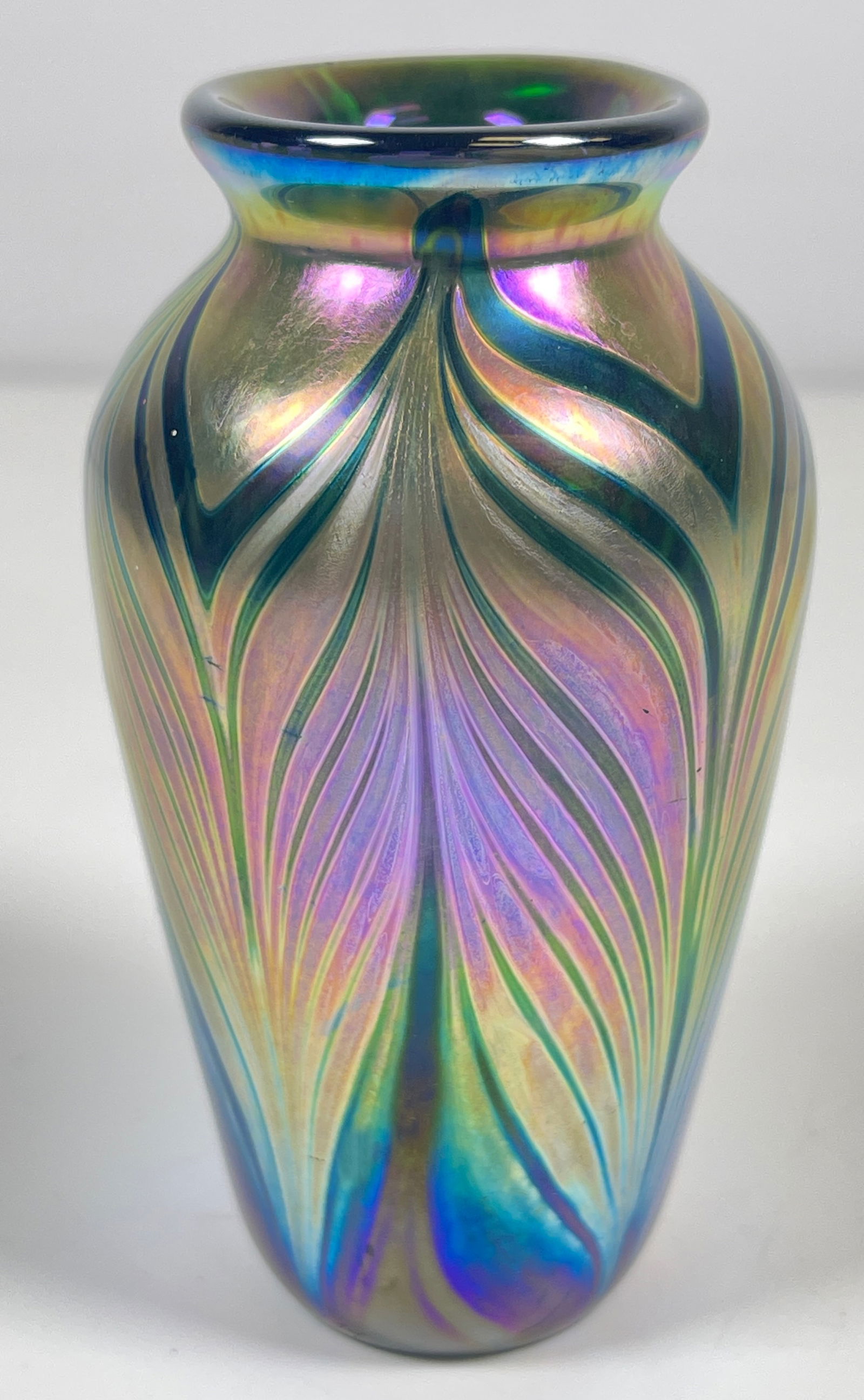 Vintage Pulled Feather Iridescent Art Glass Cabinet Vase: Dated and numbered on the side, maker illegible. Measues 3.75 inches high, 2 inches at its widest. Overall very good condition, no chips or cracks.