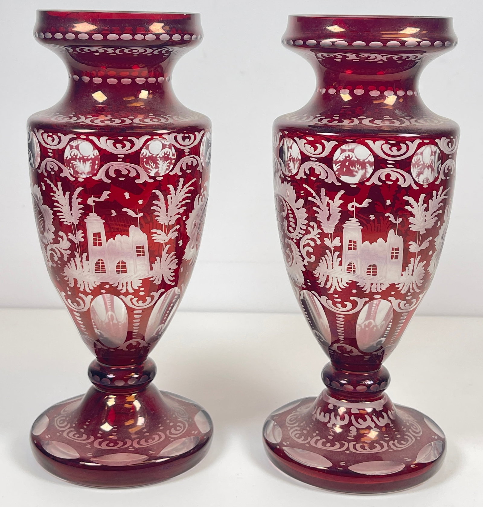 Pair Bohemian Ruby Flash Cut to Clear Huntiing Motiv Vases: Measure 9.75 inches high, 3.75 inches at their widest. Overall very good condition, no chips or cracks.
