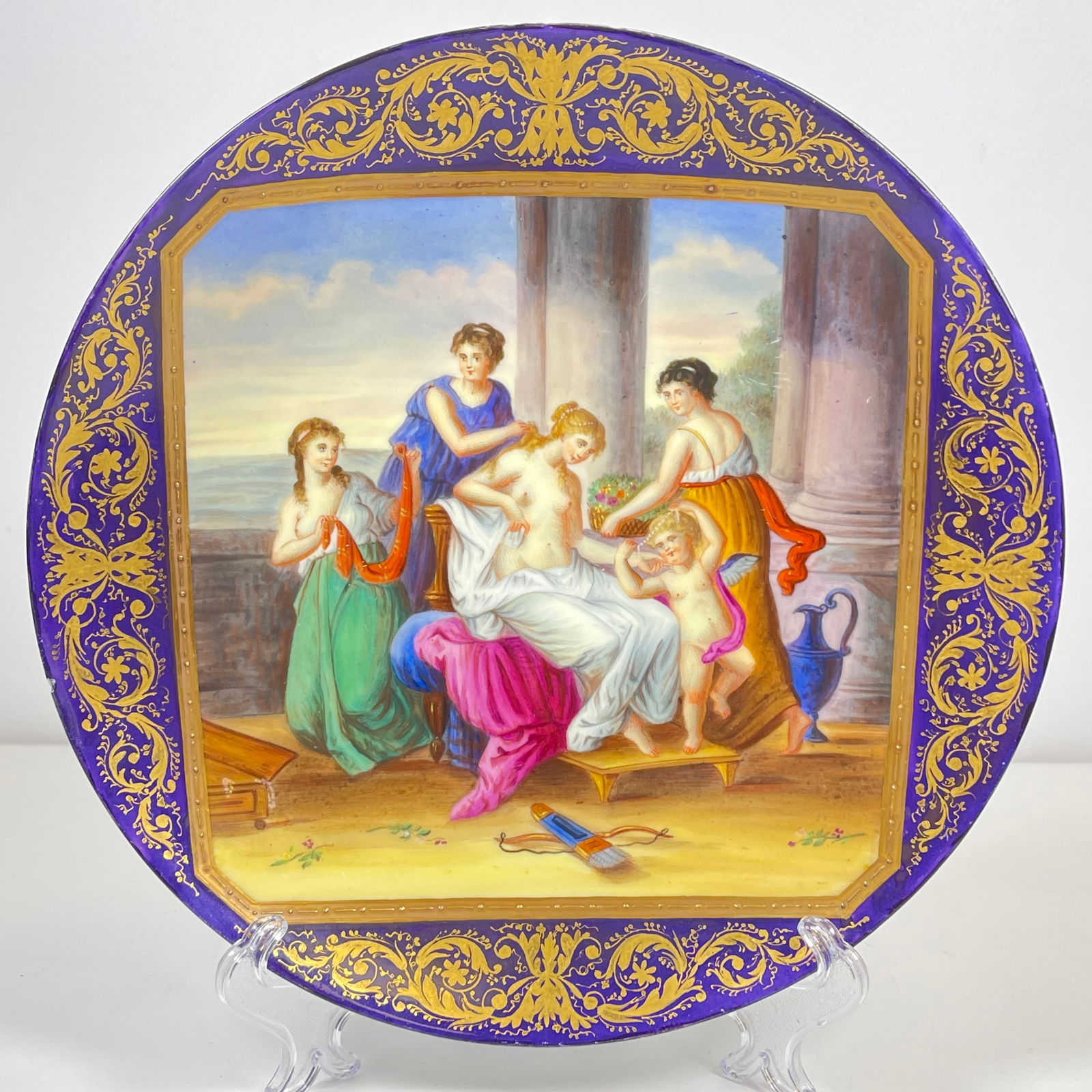 19th Century Hand Painted Cobalt Royal Vienna Style Portrait Plate: Grouping with nudes. Cobalt ground with gilt trim. Measures 9 inches in diameter. Title of plate "Decoration of Venus, Angelica Kaufmann". Overall very good condition with some minor paint loss.