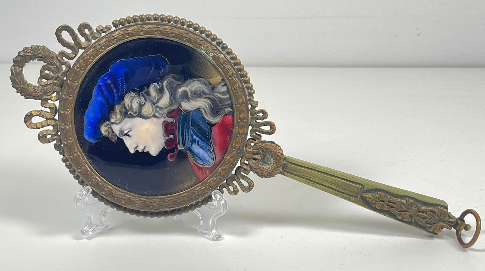 French Bronze Enamel on Copper Hand Mirror: No signature found. Mirror measures 9 inches long, enamel is 3 inches in diameter. Overall good condition.