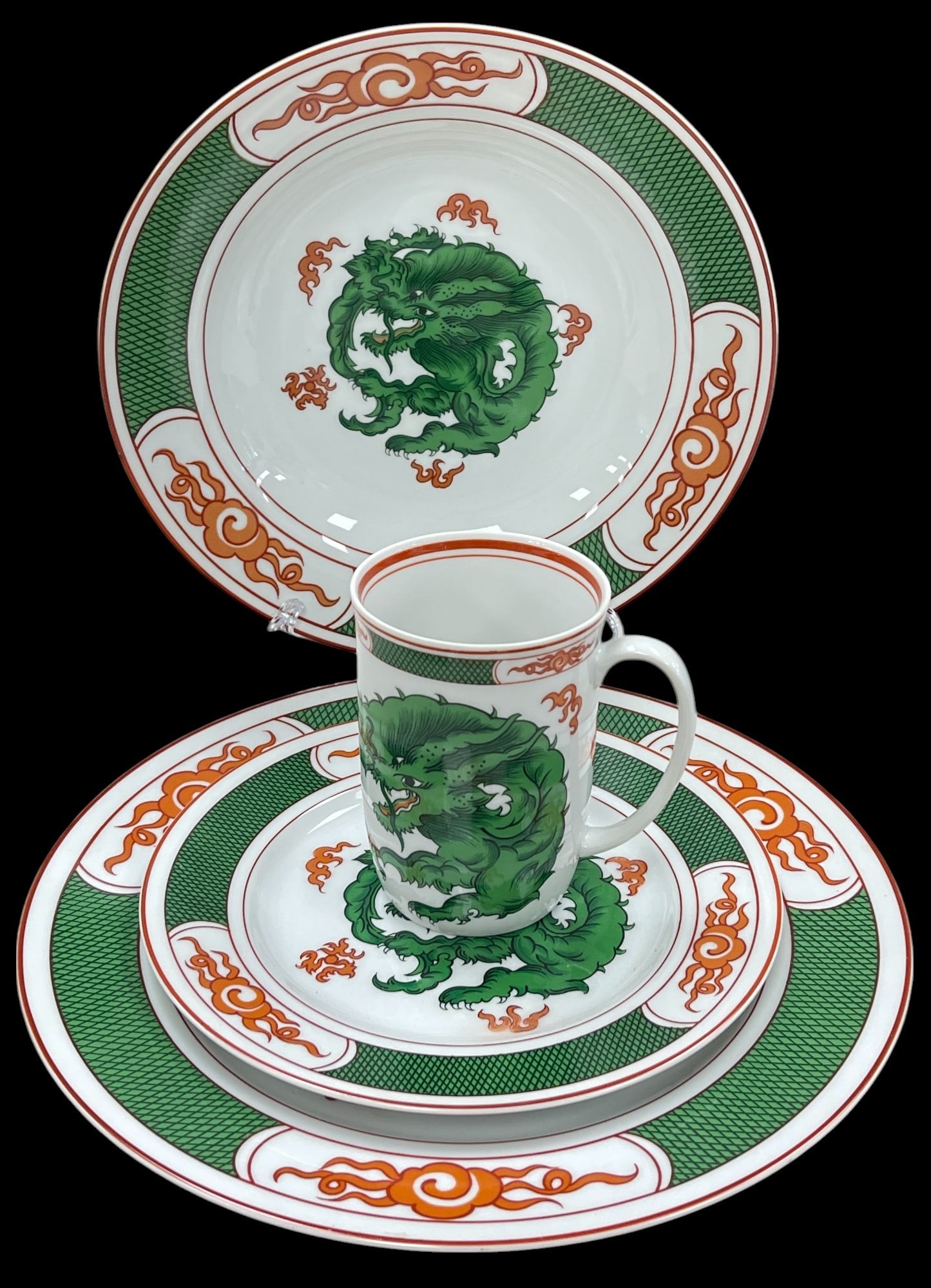 Fitz & Floyd Dragon Crest Service for 12: To include 12 plates 10.25 inches, 12 plates 7.5 inches, 12 bowls 9 inches in diameter, and 12 mugs. Also 1 serving bowl 9 inches long. Overall very good condition, no chips or cracks.