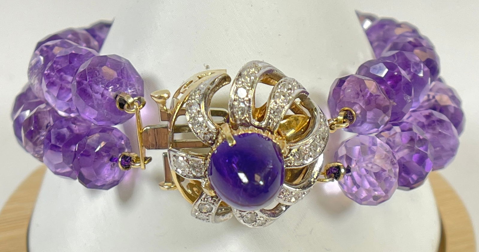 Vintage 14k Yellow Gold Diamond & Faceted Amethyst Double Strand Bracelet: Large 14k gold and diamond pendant with a center amethyst affixed to a faceted beaded double strand amethyst bracelet. 14k gold ends as well. Bracelet measures 8.5 inches long. Total weight 63.1 grams