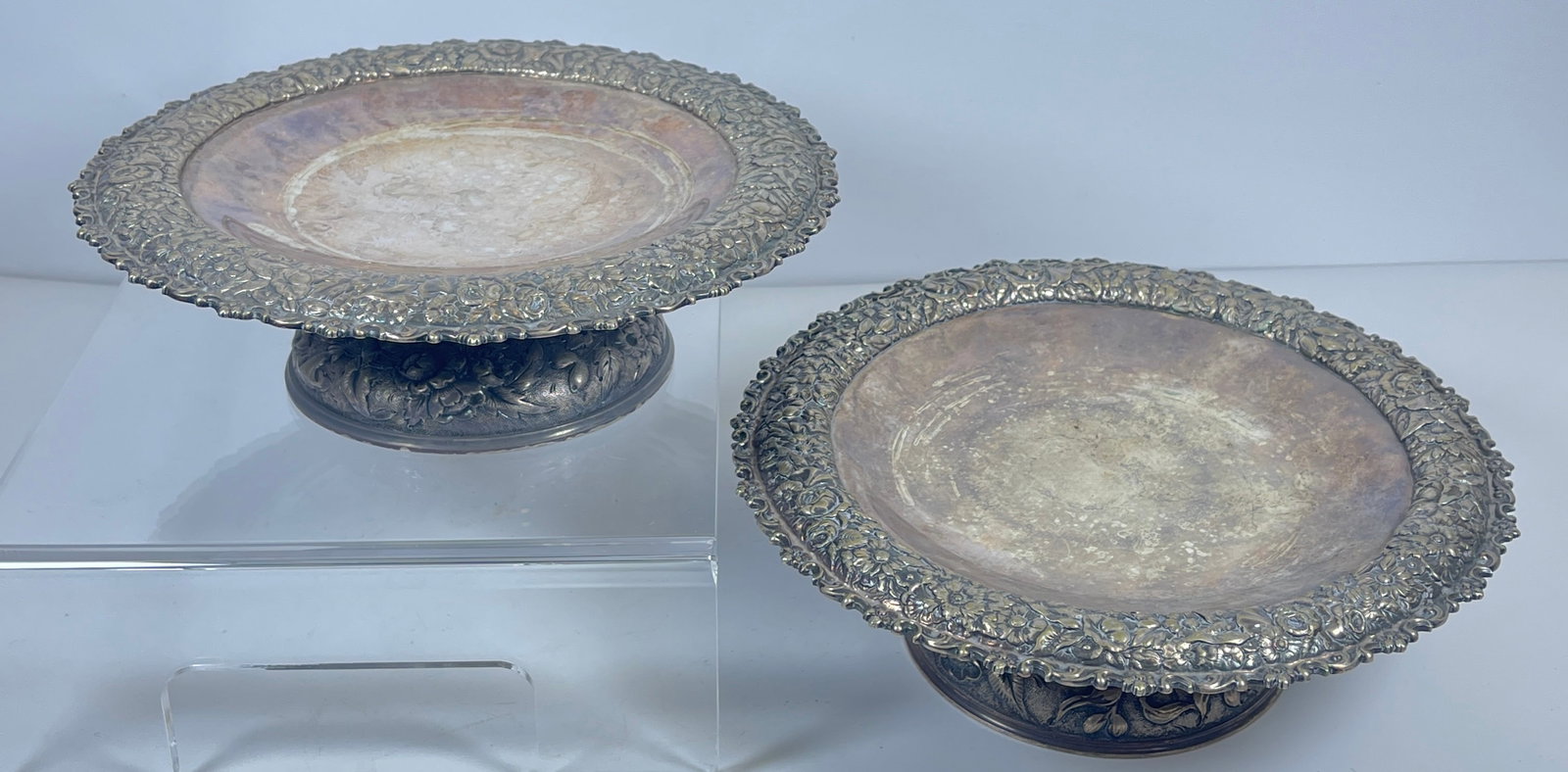 Pair Tiffany & Co. Makers Repousse Silverplate Tazzas: Pair of silverplate repousse design footed tazzas, #5816-85-H, 5102-85-G. [2.75 x 9 (dia) inches]. In good condition; tarnished.
