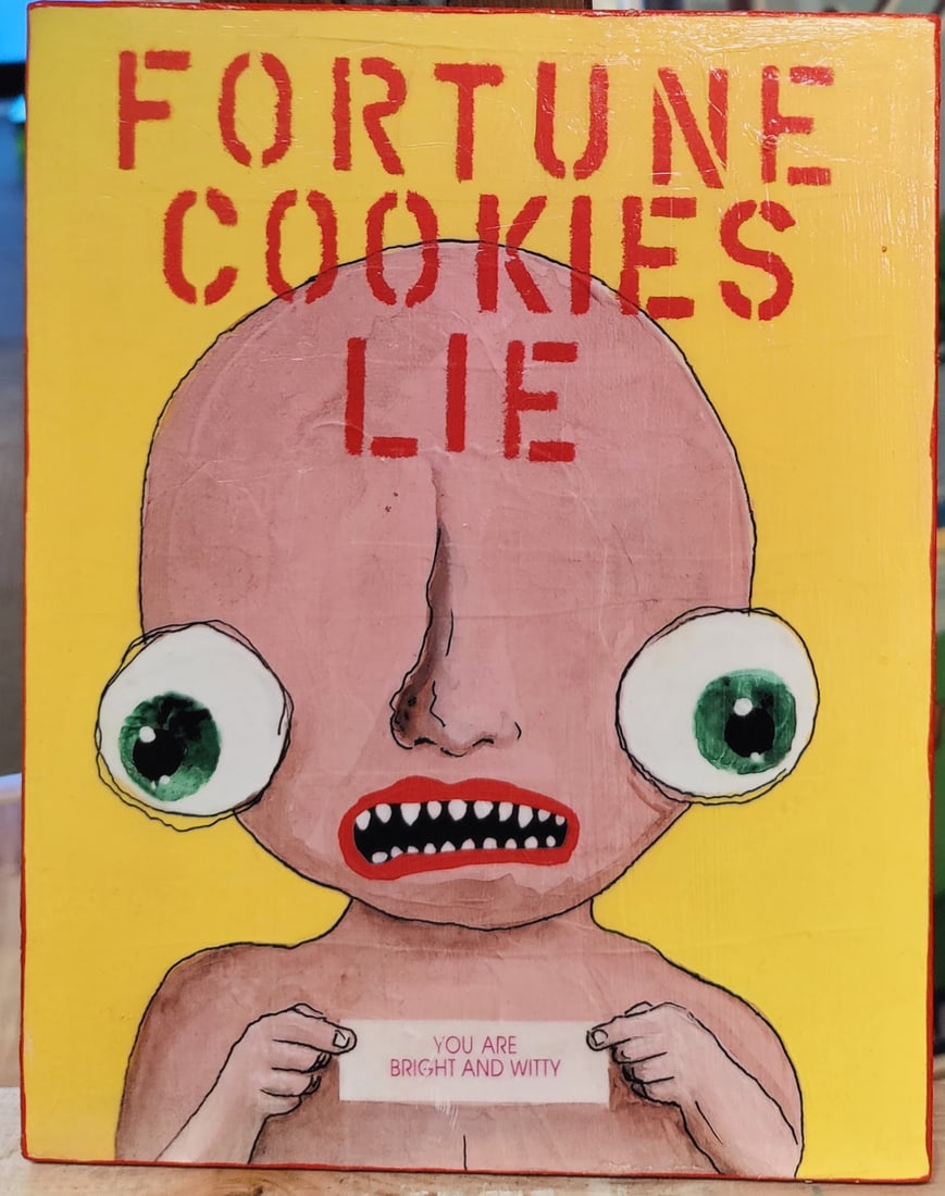 Reza Kassai Outsider Art M/M Fortune Cookies Lie: Reza Kassai (Iran, 20th/21st c.) M/M and paint on plywood titled "FORTUNE COOKIES LIE" with a Dysmorphic Human Alien Green Eyed Baby holding a fortune taped to the board, "YOU ARE BRIGHT AND WITTY". V