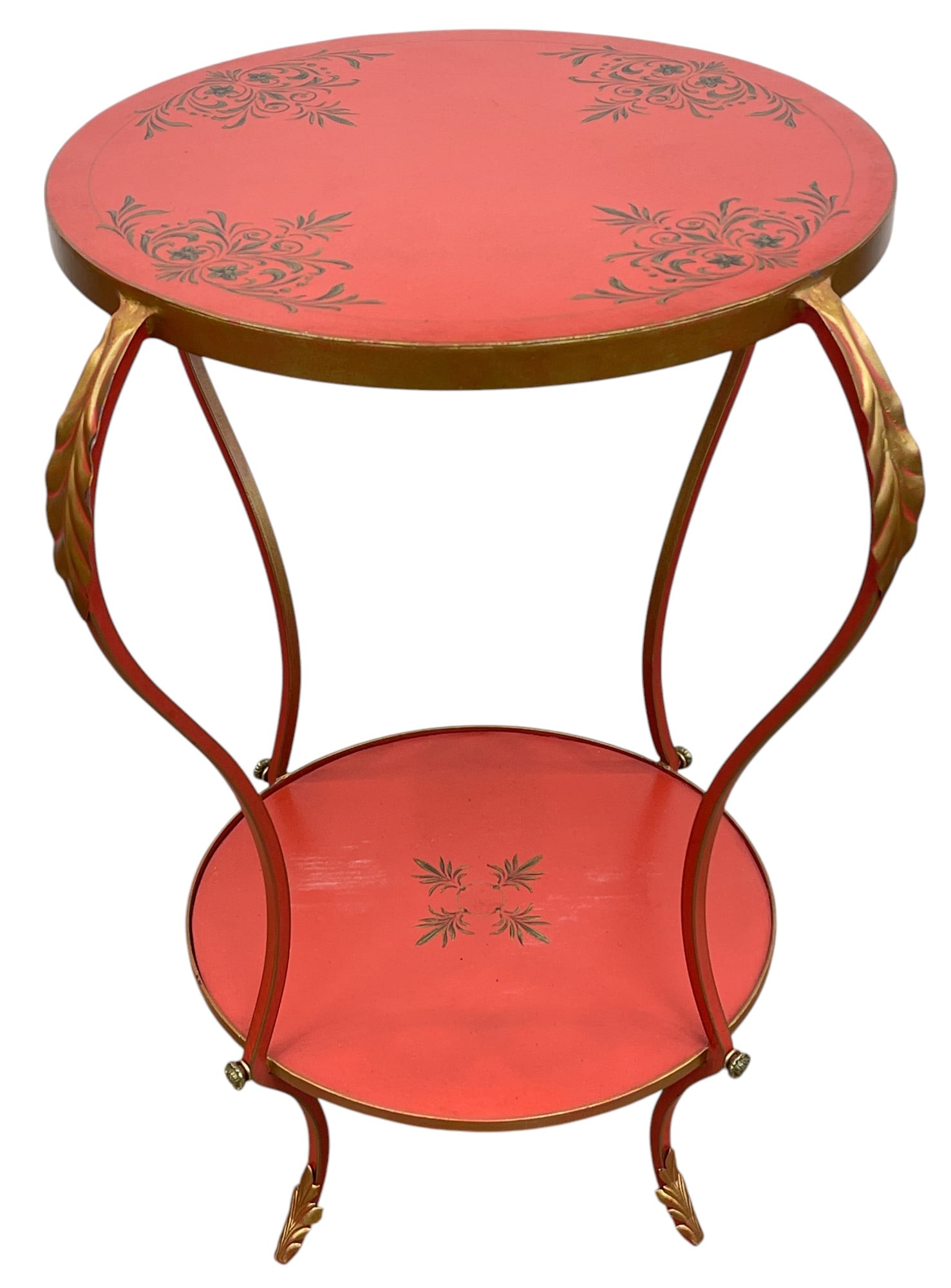 Mid Century Gilt Decorated Tole Table: Round table, gild decorated over light red tole. Overall good condition. Measures 32 inches high, 28 inches in diameter.