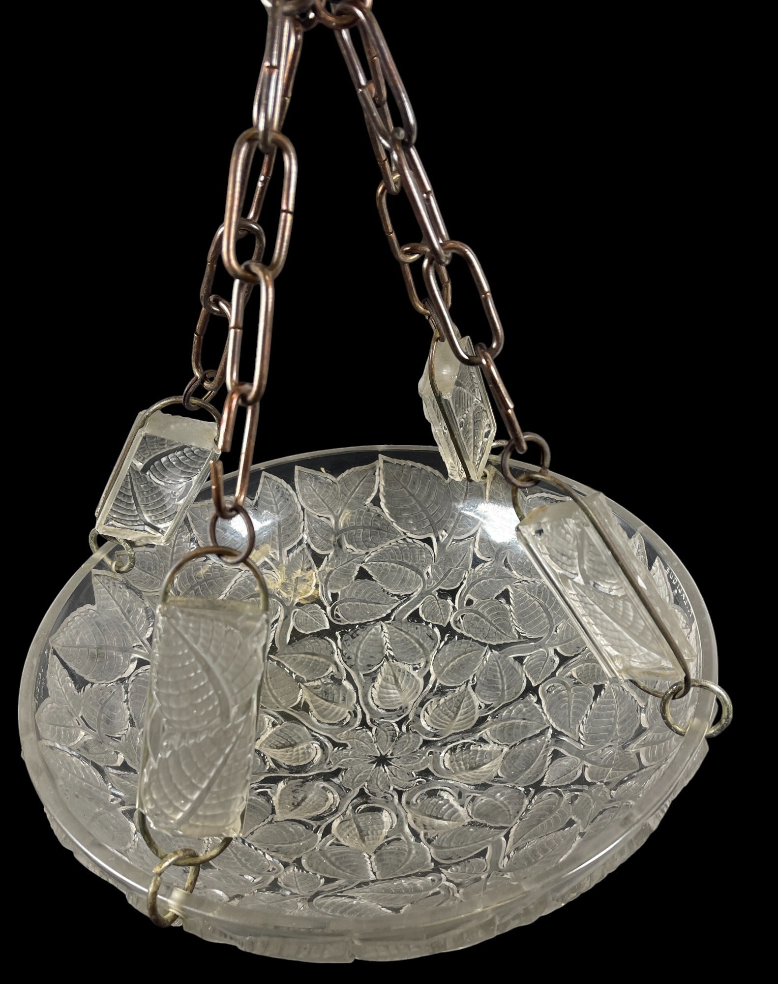 c1920 R. Lalique Charmes French Glass Chandelier: Early 20th C. French art glass Rene Lalique 'Charmes' plafonnier. This chandelier has a repeating leaf tip motif throughout the dome. Complete with all four glass suspension appliques, one has a chip.