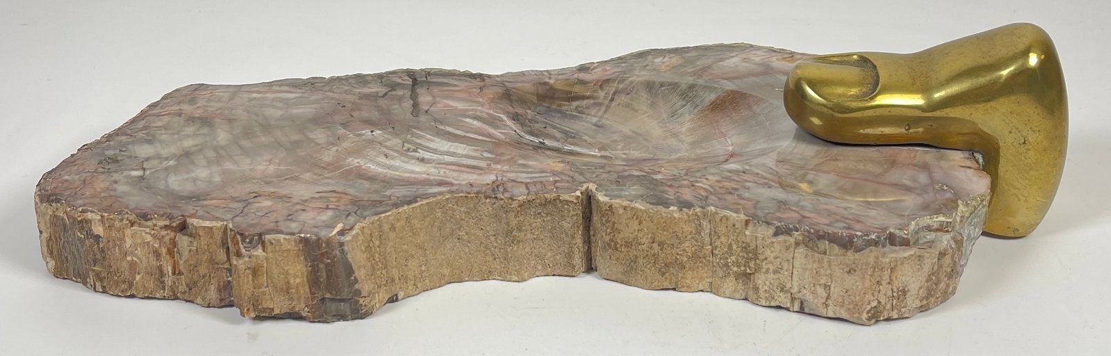 Surrealist Pietrina Checcacci Gilt Bronze & Petrified Wood Dish: Pietrina Checcacci (Italian, 20th / 21st century), gilt bronze finger signed "Checcacci," attached to a piece of petrified wood with a hollow bowl for coins or keys. Overall very good condition. Measu