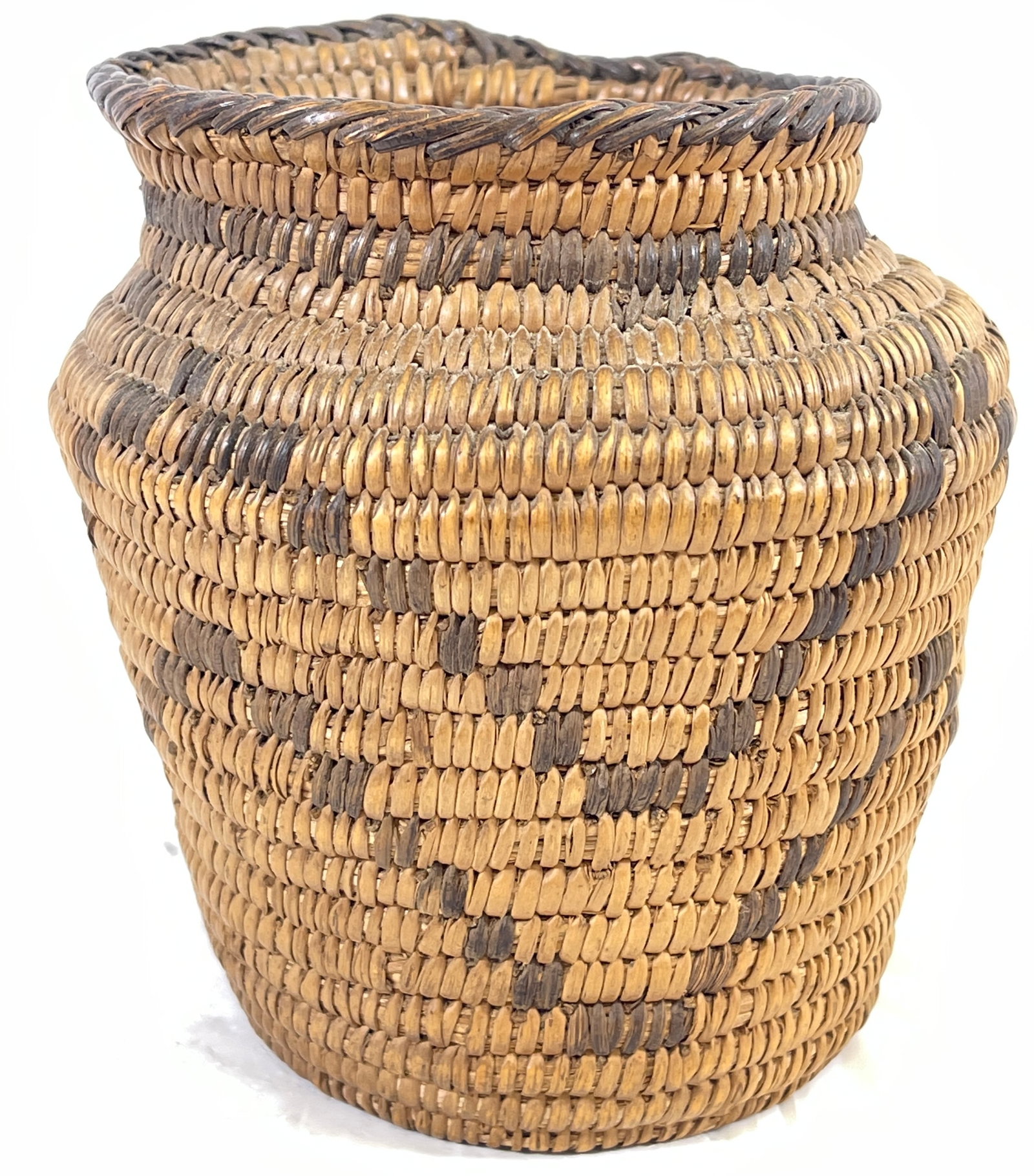 c1910 Western Apache Native American Hand Coil Storage Jar: Narrow hand coil black martynia stitching, overcast self stitch rim, 3 narrow bunched rod foundation tight fine coil. Basket measures 5.25 inches high, 5 inches wide. Overall good condition. Please se