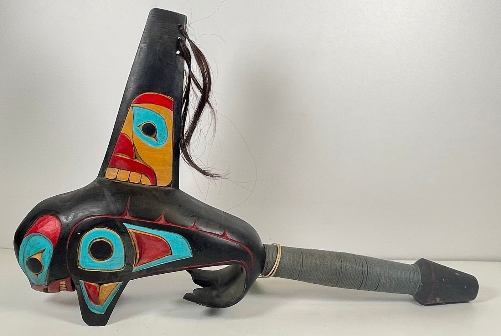 Northwest Coast Haida Shamans Figural Rattle: Killer whale, raven and puffin carved out on rattle. Carvers hair decoration on the fin. Overall good condition, please see photos. Measures 18.5 inches long, 12 inches wide.