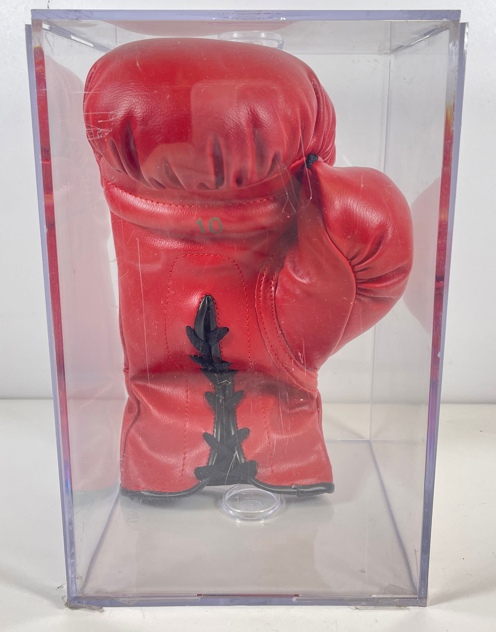 Ken Norton, Joe Frazier, & Leroy Neiman Signed Boxing Glove: Multi signed Everlast Boxing glove. Features 3 signatures including Ken Norton, Joe Frazier, and LeRoy Neiman. No COA present. ontained in a plastic presentation box. This item comes directly from a l