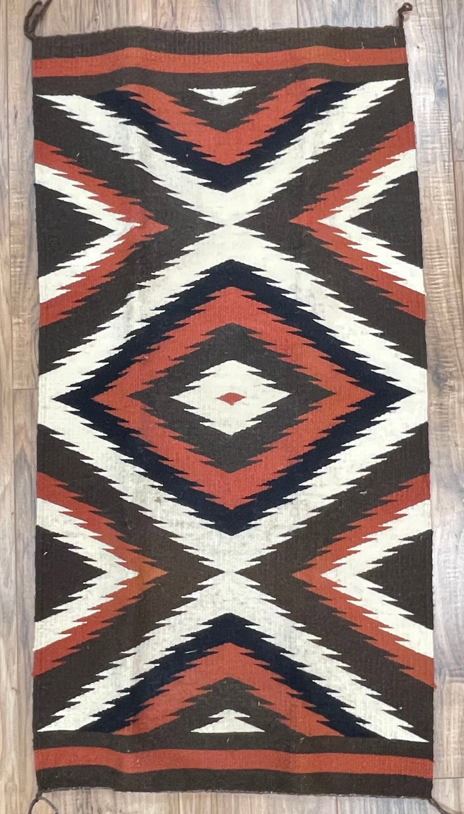 Vintage Native American Navajo Ganado Area Rug: 19 inches x 38 inches. Ovrall good condition. Please see photos. Came from an extensive collection of American Indian items.