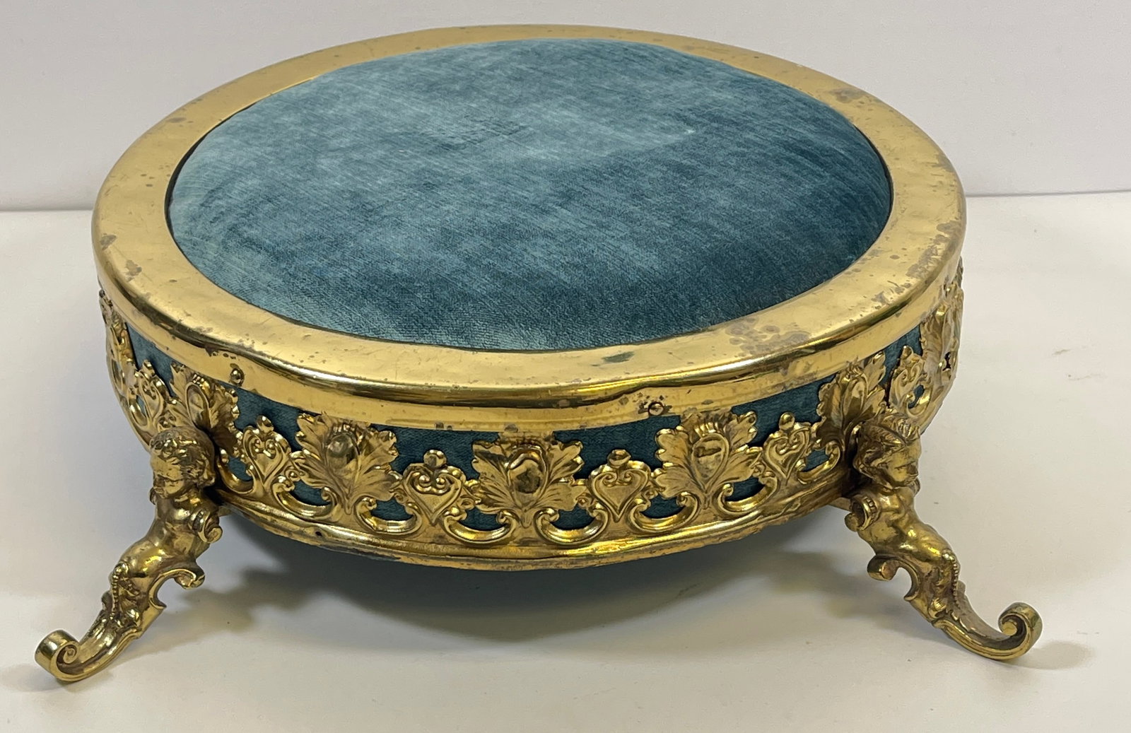 Victorian Bronze Mounted Foot Stool: Newly upholstered. Stool measures 4.25 inches high, 12 inch diameter across the top. Overall good condition, see photos.