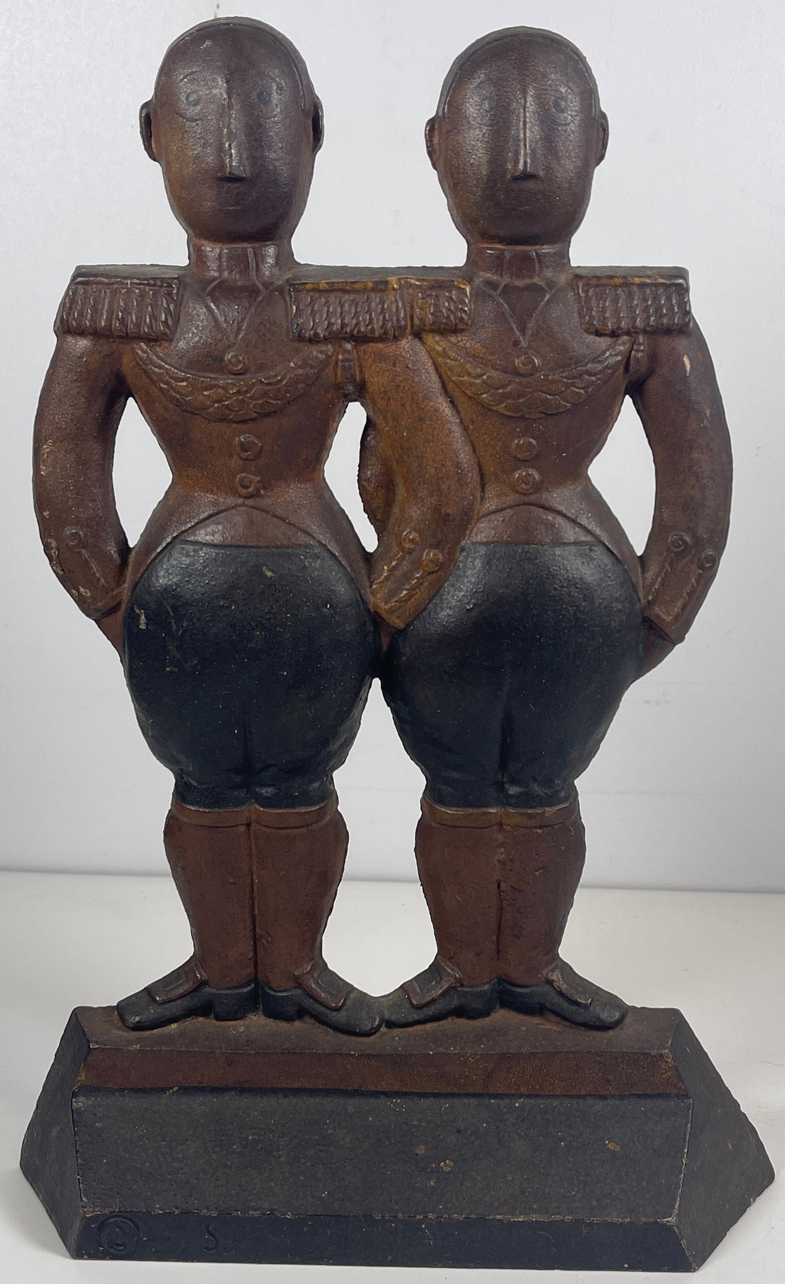 Hubley Fish Cast Iron Double Footman Door Stop: Circa 1930 cold painted cast iron figural doorstop by Hubley and designer Anne Fish, depicting two English footmen at attention, stamped "FISH" with copyright mark to front of base, and impressed '248