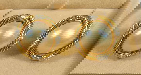 Pair 14k Yellow Gold Diamond & Pearl Earrings: Clip back earrings with 10mm pearl with approx .25 carats of diamonds on each. Total weight 4.7 dwt (7.4 grams).