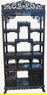 19th Century Chinese Floral Carved Etegere: A nineteenth century Chinese hardwood etegere having intricate carvings of leaves and flowers. Overall good condition, please see photos. Ensuite Ht: approx 86 inches high, 39 inches wide, 15 inches d