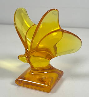 Baccarat Crystal Signed Butterfly Pedestal Amber Paperweight: A Baccarat crystal "Butterfly" figurine. Depicts a butterfly with open wings in amber colored crystal. Style: #762654. Marked with "Baccarat" hallmark on the underside. Measures 3.75 inches high. Over