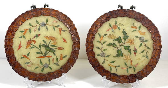 Pair Carved Chinese Jade Plaques: Pair of chinese jade plaques, circular flattened form with carved wooden frame, smooth surface with carved and brightly painted plant life details. Measure 6.5 inches in diameter not including hanger.