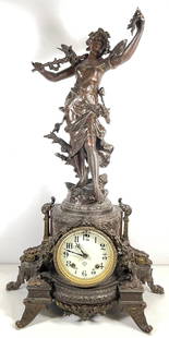 Ansonia Clock Co Figural after Moreau Nymphe de Bois Clock: The figure at the top of the clock is a copy of Moreau's Nymphe de Bois. Measures 24 inches high, 15 inches wide, 8 inches deep. Overall good working condition, repair to one of the wings, please see