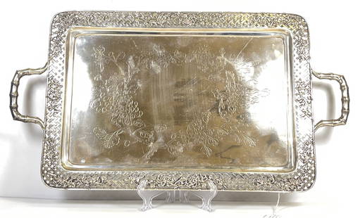 19th Century Luen Wo Chinese Export Silver Bamboo Handled Tray: A Chinese Export Silver Tray engraved with flowers on a matte background, lattice edged with repousse chrysanthemum decoration to the border, and with two bamboo shaped handles. Marked on verso. Measu