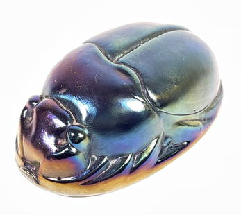 Tiffany Studios Favrile Scarab Paperweight: Tiffany Iridescent Favrile Glass Scarab. Unsigned. Measures 4.75 inches long, 3 inches wide, 2 inches high. Overall good condition, no chips or cracks.