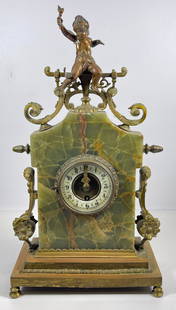 19th Century French Bronze & Green Onyx Figural Clock: Bronze cherub sits atop the clock, scrolls and flowers attached to green onyx body. Works marked Gustav Becker, and Medalle D'or. Overall good condition, currently working but not guaranteed. No key.