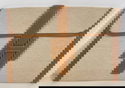 Hermes Vintage Caramel & Toile Large Jige Clutch: Vintage Hermes jige beige toile and caramnel leather trim clutch. H Logo closure with white stitching. Fabric interior. Measures approx. 11.5 inch width, 7.75 inch height. Overall very good condition,